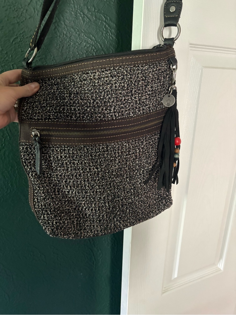 The Sak Brown and Black Woven Crossbody with Tassel Bead Charm